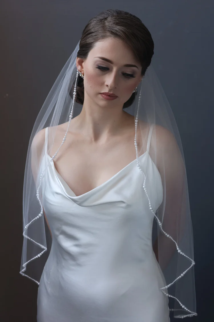 Pearl trimmed wavy cut fingertip length Maho Bay bridal veil by